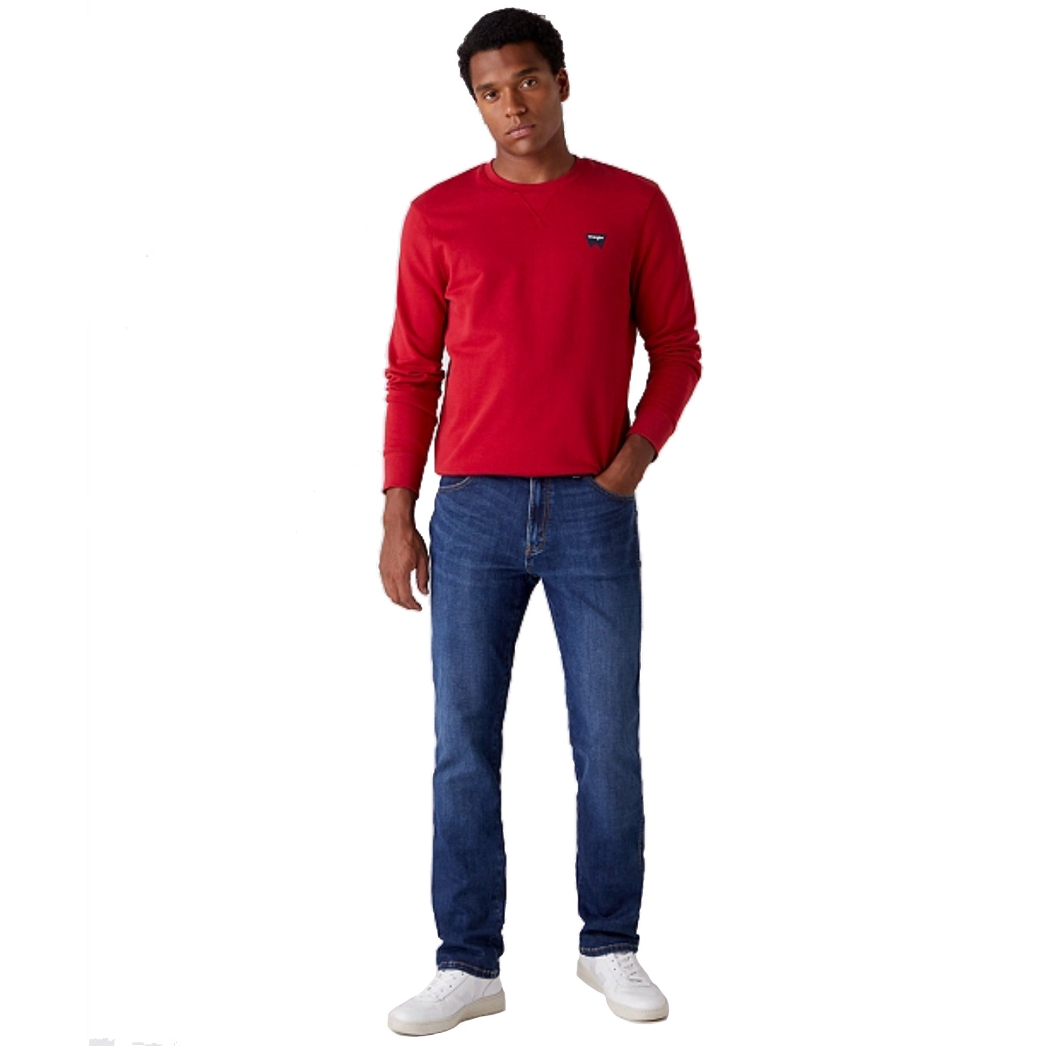 Wrangler Sign Off Sweatshirt in Red Worn By Model With His Hand In Jeans Pocket